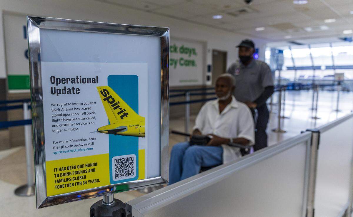Signs announcing Spirit Airlines ceasing its global operations are seen at Fort Lauderdale-Hollywood International Airport on Saturday, May 2, 2026.